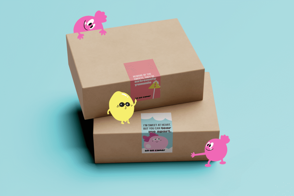 Go Go Candy geschenkdozen met speelse snoepmannetjes en afsluitstickers met de teksten 'extremely yummie' en 'I'm sweet at he