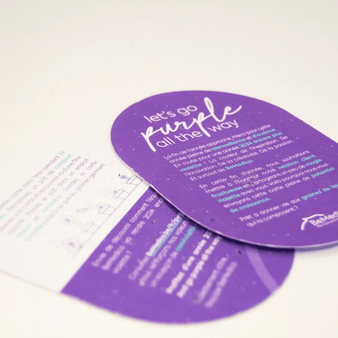 Paarse plantbare eindejaarskaart van BeMedico met de tekst 'Let's go purple all the way', ontworpen door Graviteit